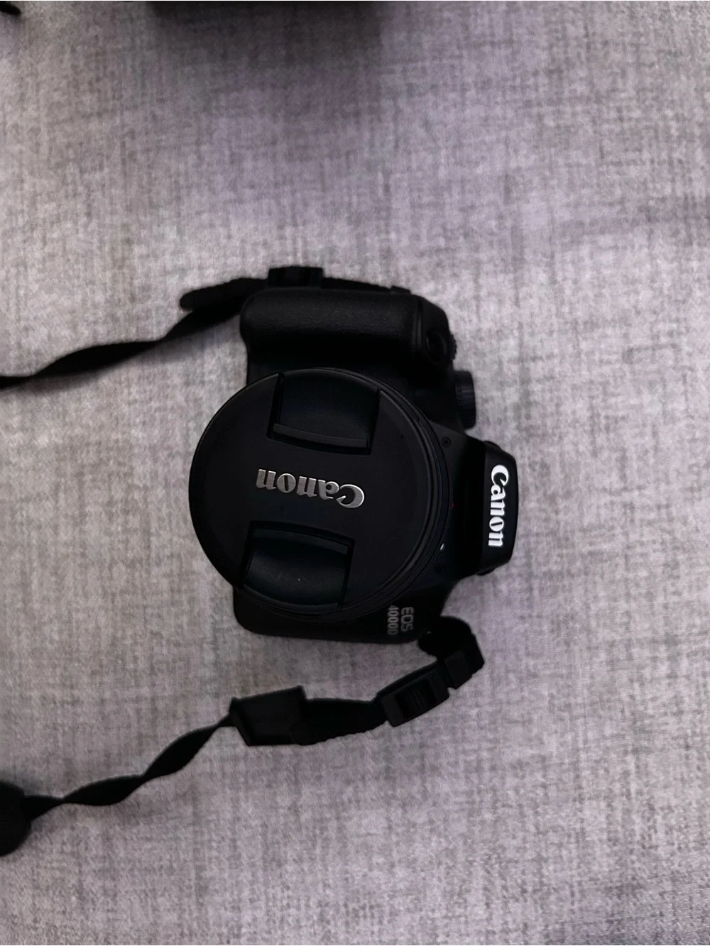Canon DSLR Camera with Black Body and Red-Trim Strap